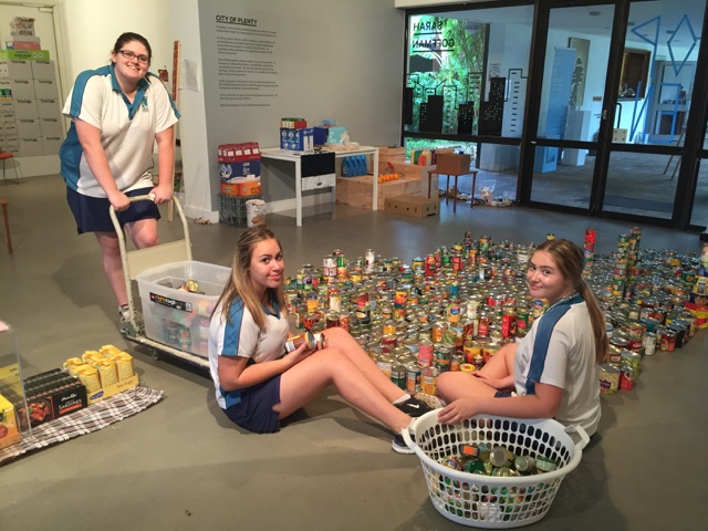 Isabella Richardson, Amy DiCristoforo and Roisin Cairney work on the suburban sprawl of cans